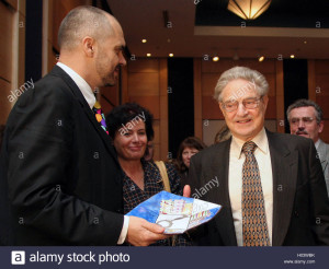 U.S. philanthropist George Soros (R) is awarded the medal of "Honoured Citizen" by Edi Rama, mayor of Tirana, for his contribution in improving Albania's education and infrastructure, in the Albanian capital Tirana November 18, 2005. Since its opening in 1992, the Soros Open Society Foundation has spent some $48 million on projects in Albania aimed at improving governance, reforming institutions, enhancing opportunities for youth and fostering a better environment for business development. Separately, Soros has earmarked $57 million for projects specifically for improving education in Albania. REUTERS/Arben Celi