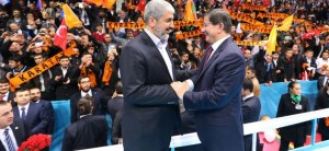 epa04540867 A handout picture provided by the Turkish Prime Minister Press Office shows Hamas leader Khaled Mechaal (L) and Turkish Prime Minister Ahmet Davutoglu (R) shakeing hands during a congress of Turkey's ruling Justice and Development Party (AKP) in Konya, Turkey, 27 December 2014. Davutoglu and Hamas leader attended a AKP party congress in Konya city. EPA/TURKISH PRIME MINISTER PRESS OFFICE / HANDOUT HANDOUT EDITORIAL USE ONLY/NO SALES
