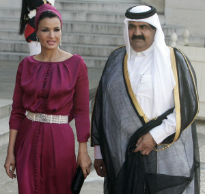 FILE - In this Monday, June 22, 2009 file photo, Emir Of Qatar Sheik Hamad Bin Khalifa Al Thani, right, and his wife Sheika Moza Bint Nasser Al Misnad arrive for the state dinner at the Elysee Palace in Paris. (AP Photo/ Francois Mori, File)