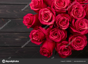 Roses with Gift box and pink ribbon on black board, Valentines background, wedding day. Love Concept. Valentines day Card with red hearts on black background with copyspace for greeting text